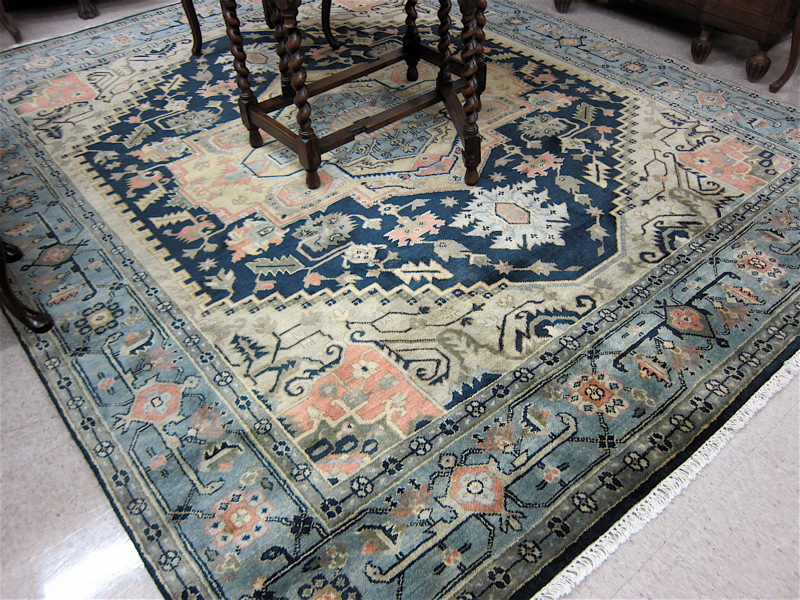 Appraisal: HAND KNOTTED ORIENTAL CARPET Persian Serapi design central geometric medallion