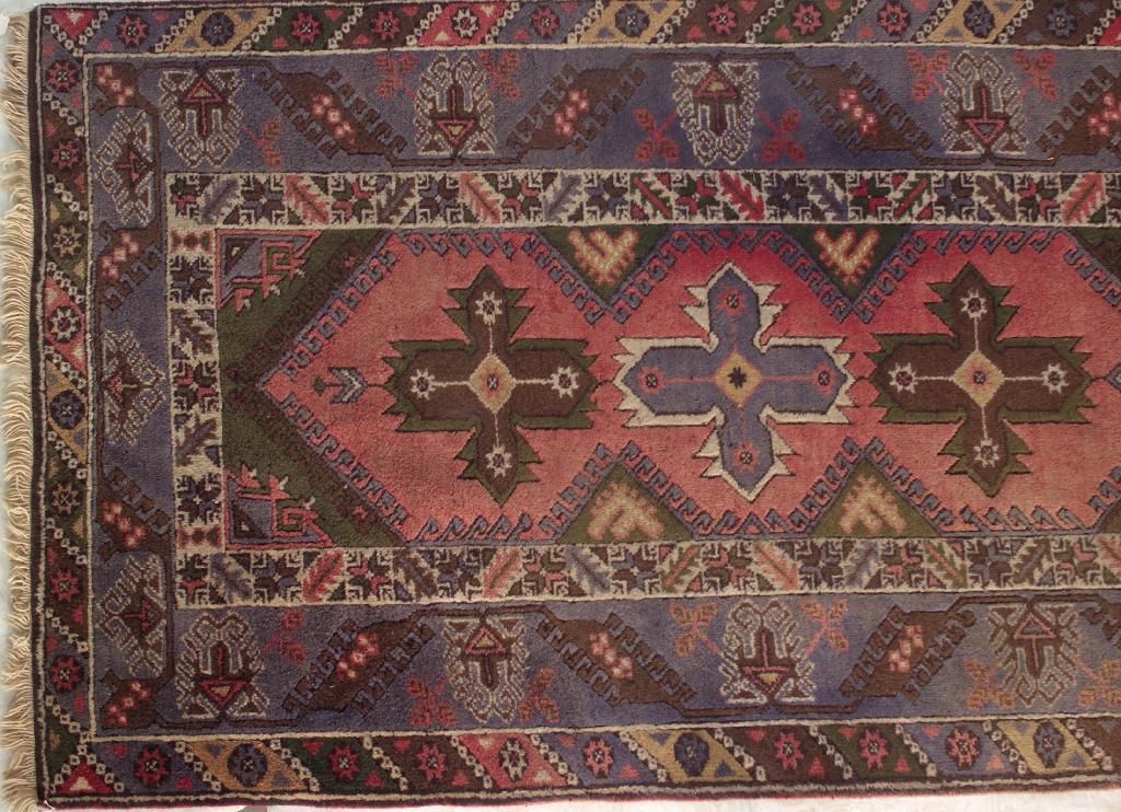 Appraisal: TURKISH RUG central field with a pink ground within mid