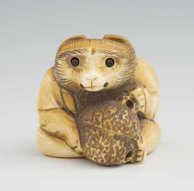 Appraisal: A Carved Ivory Netsuke of a Seated Monkey With Peach