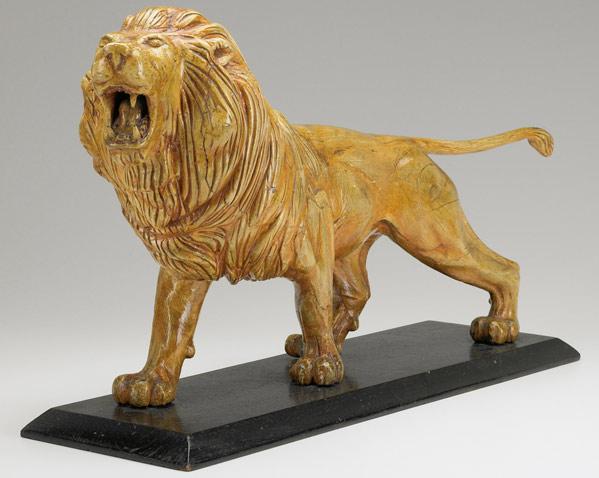 Appraisal: FOLK ART WOOD CARVING Full figure roaring lion on an