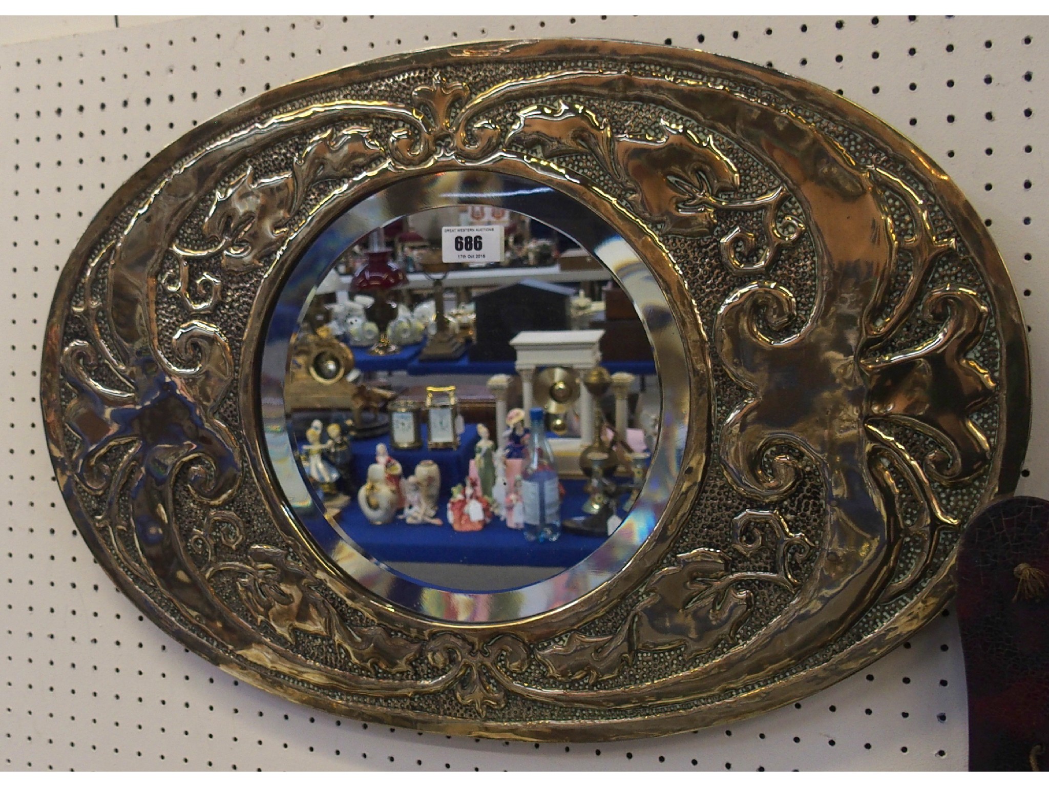 Appraisal: Brass repousse oval framed mirror