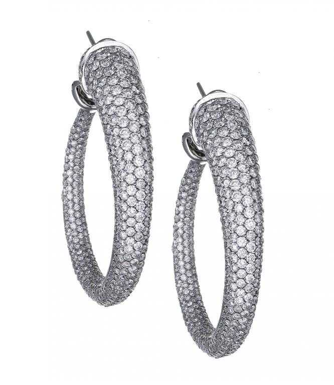 Appraisal: A PAIR OF DIAMOND EARRINGS designed as a tapered pav