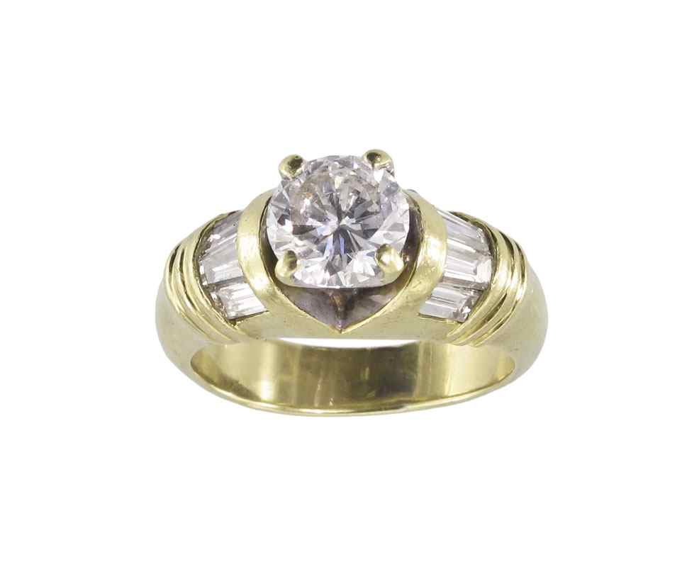 Appraisal: CT CENTER DIAMOND PLUS BAQUETTES RING K yellow gold ring