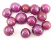 Appraisal: A quantity of loose polished star rubies approx weight carats