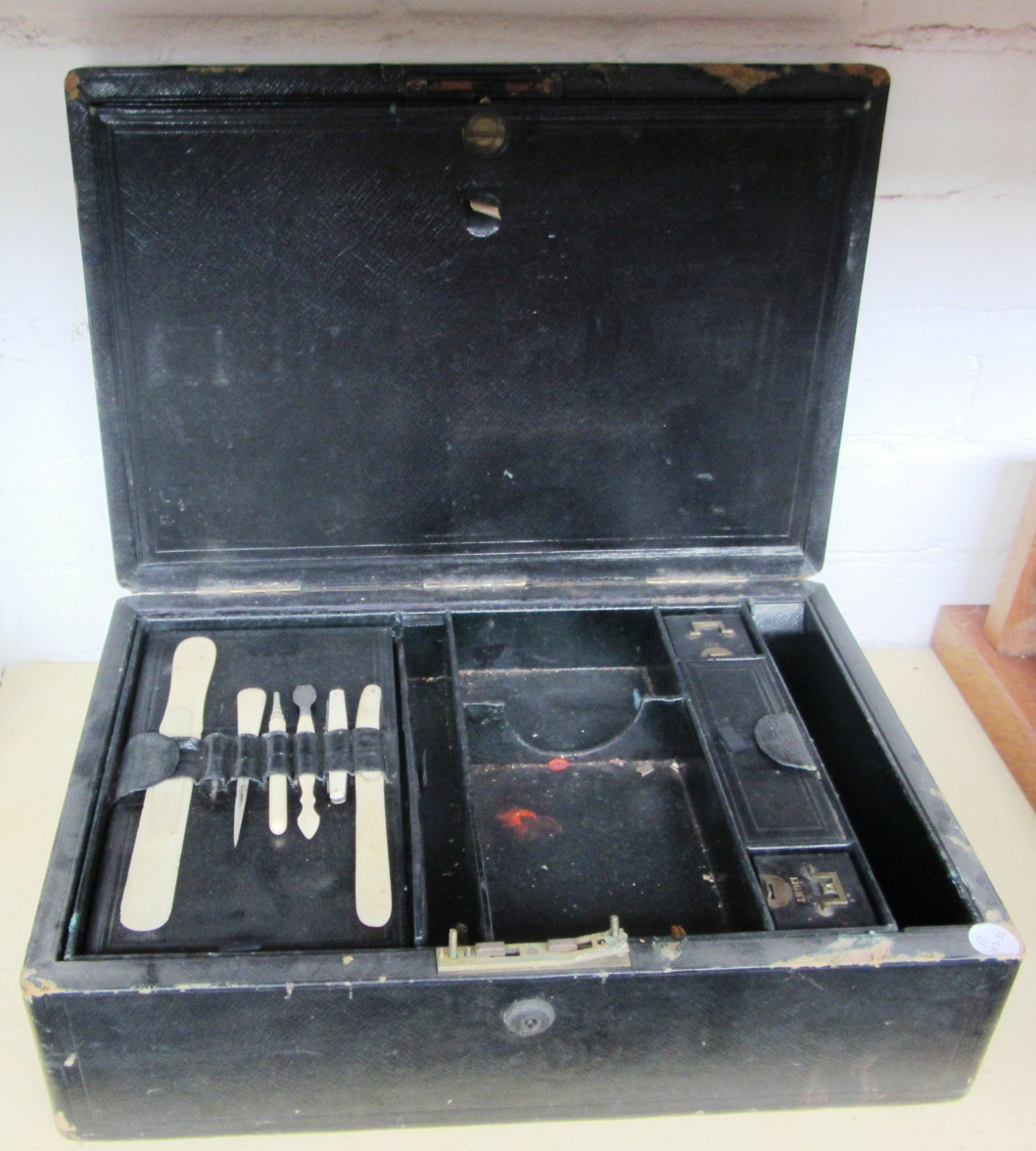 Appraisal: A Victorian black leather portable writing box and a pair