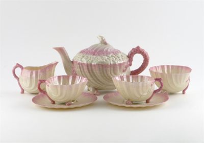 Appraisal: A Belleek Neptune t te t te set fringed in