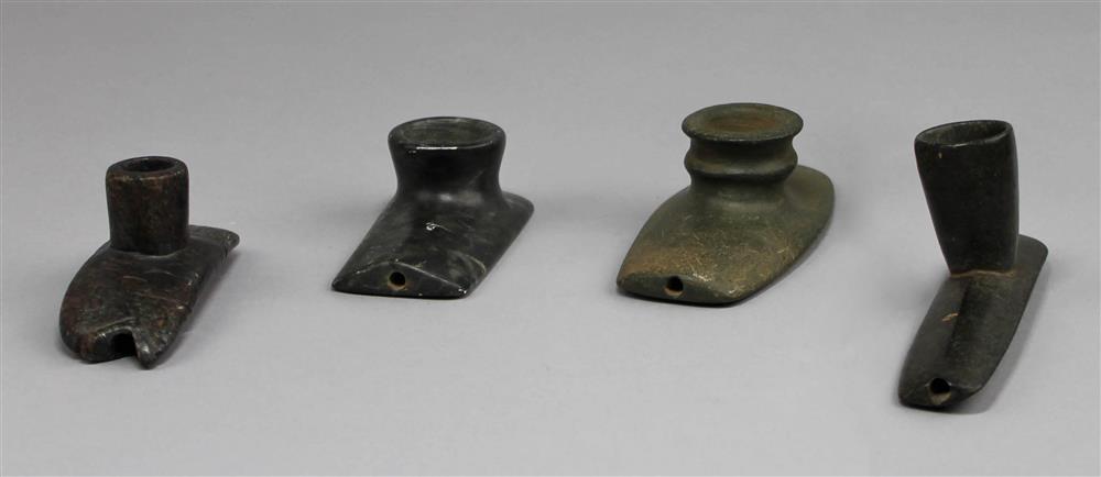 Appraisal: FOUR STEATITE AND SERPENTINE PLATFORM EFFIGY PIPES th C reproductions