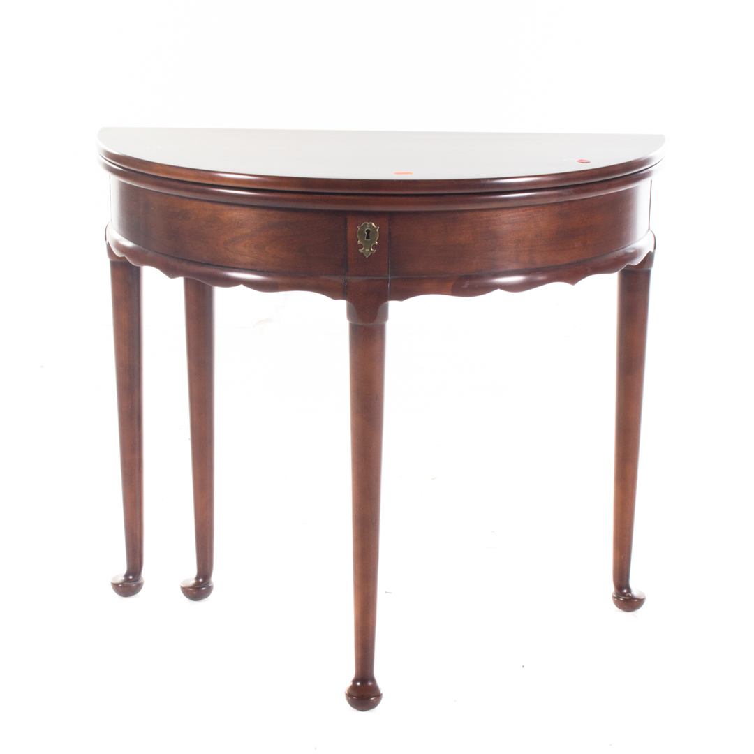 Appraisal: Mahogany flip-top demilune table