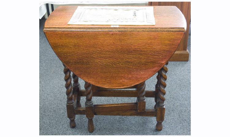 Appraisal: Oak Gateleg Table Of Oval Form Moulded Edge Barley Twist