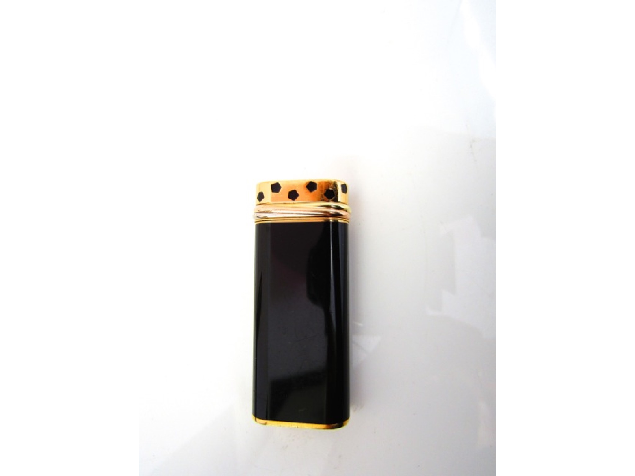 Appraisal: A Cartier lighter with black lacquered finish stamped no C