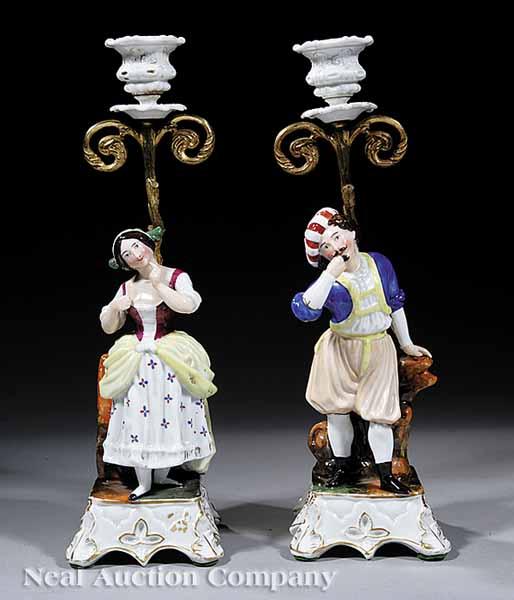 Appraisal: A Pair of Paris Polychrome and Gilt-Decorated Porcelain Figural Candlesticks