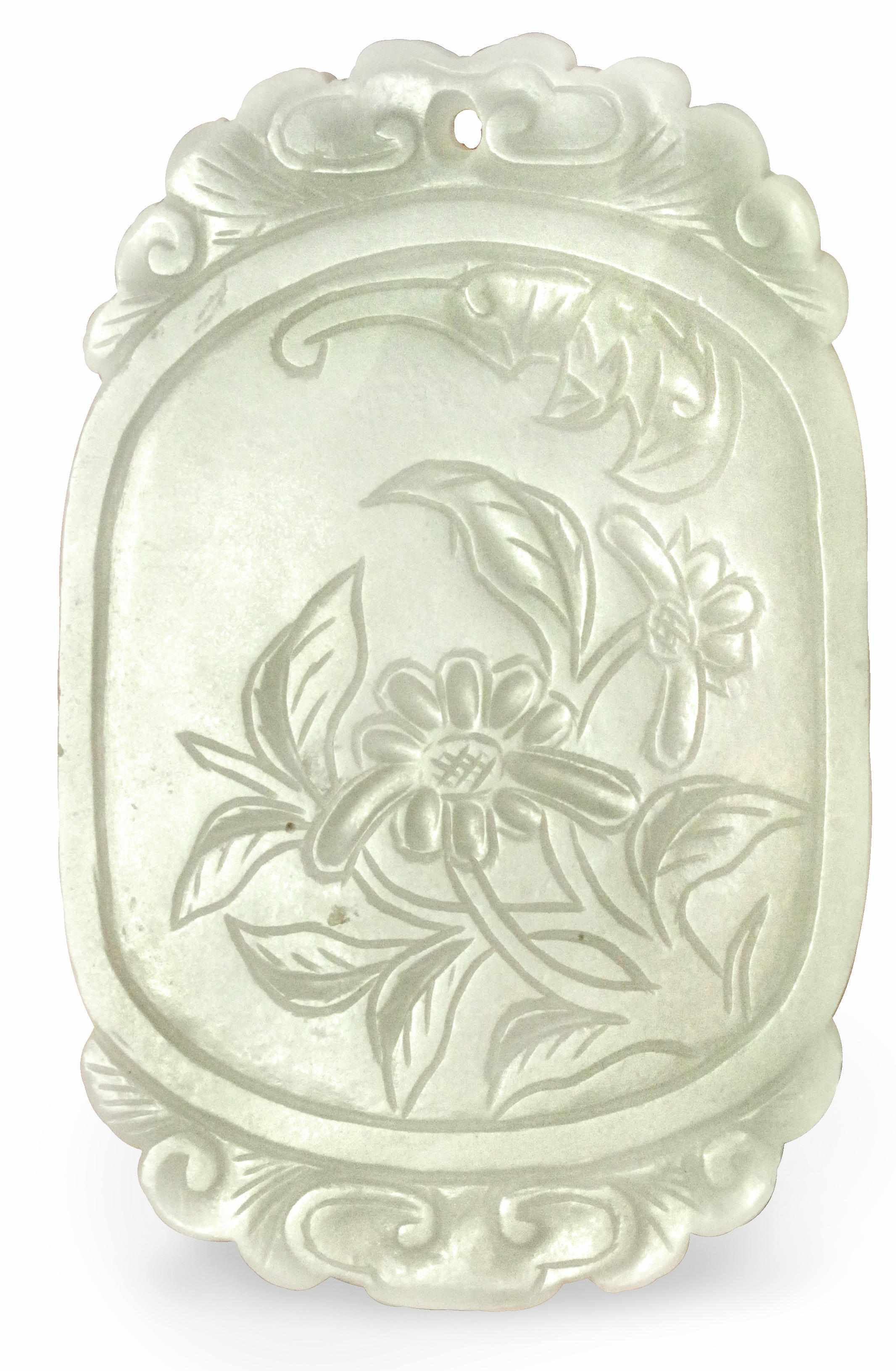 Appraisal: A Chinese white nephrite jade oval pendant carved with flowers