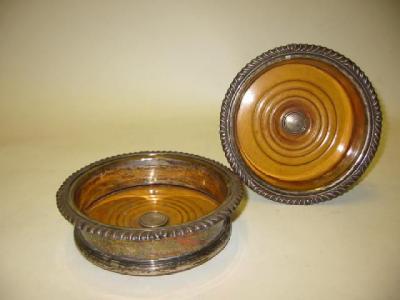 Appraisal: A PAIR OF BOTTLE COASTERS th century with gadrooned rim