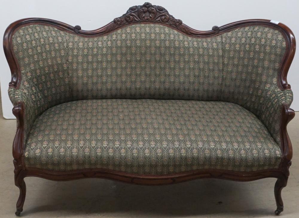 Appraisal: VICTORIAN ROCOCO STYLE WALNUT CAMEL BACK SOFA L IN CM