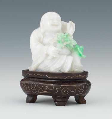 Appraisal: A Carved White Jade Buddha with Green Finely carved and