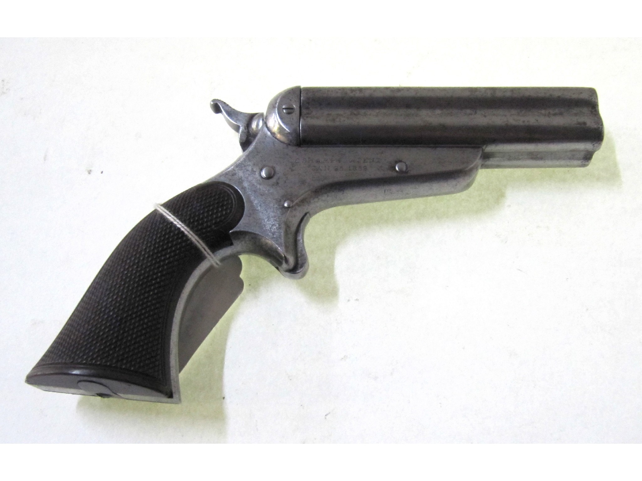 Appraisal: A Sharp's -barrel Derringer with chequered grip marked C Sharps