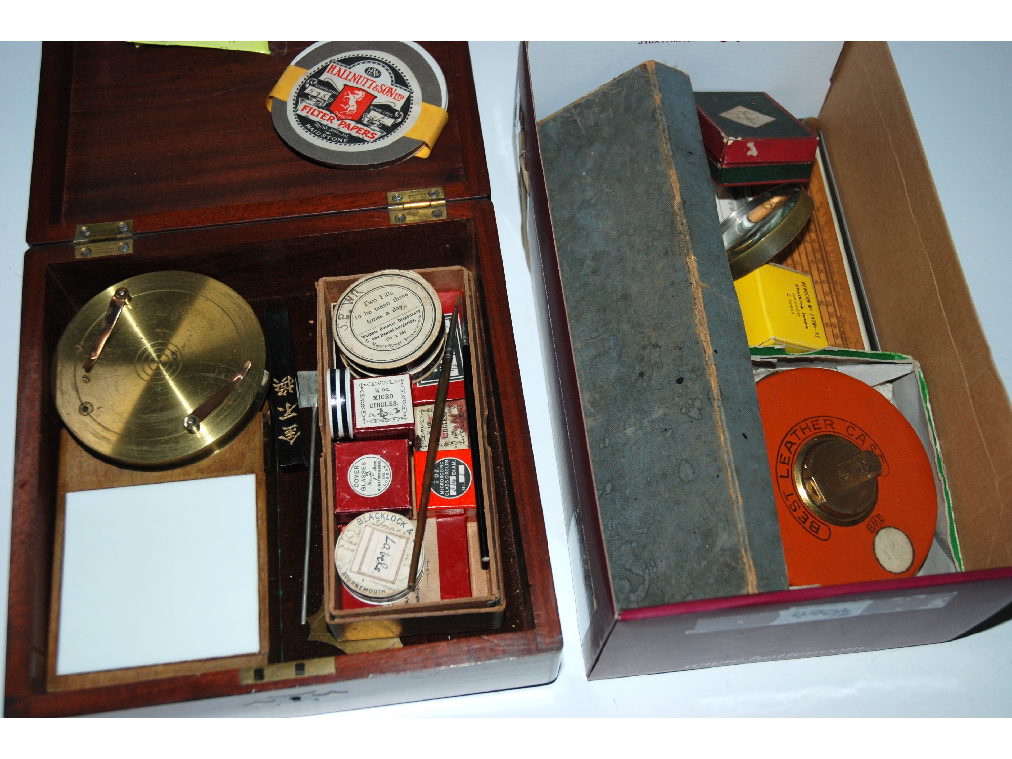 Appraisal: A microscope stand various glass slides leather cased tape measure