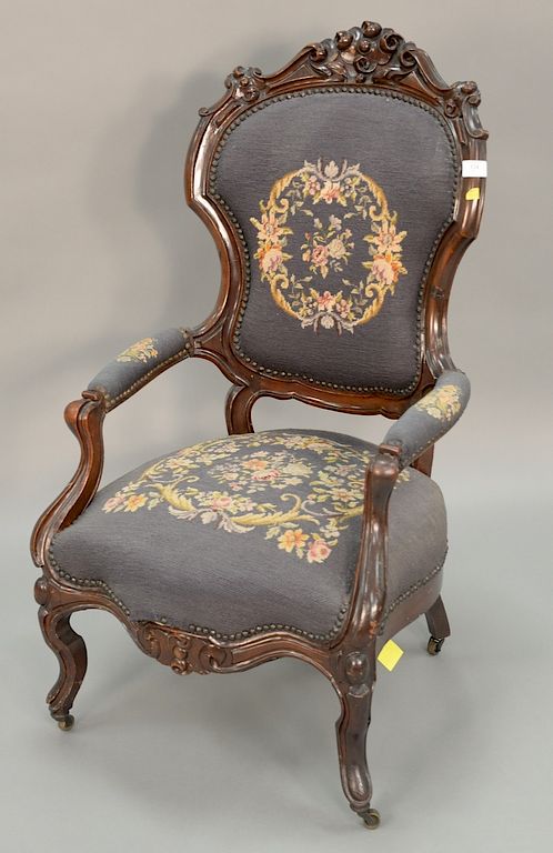 Appraisal: Victorian gents chair with needlepoint Victorian gents chair with needlepoint