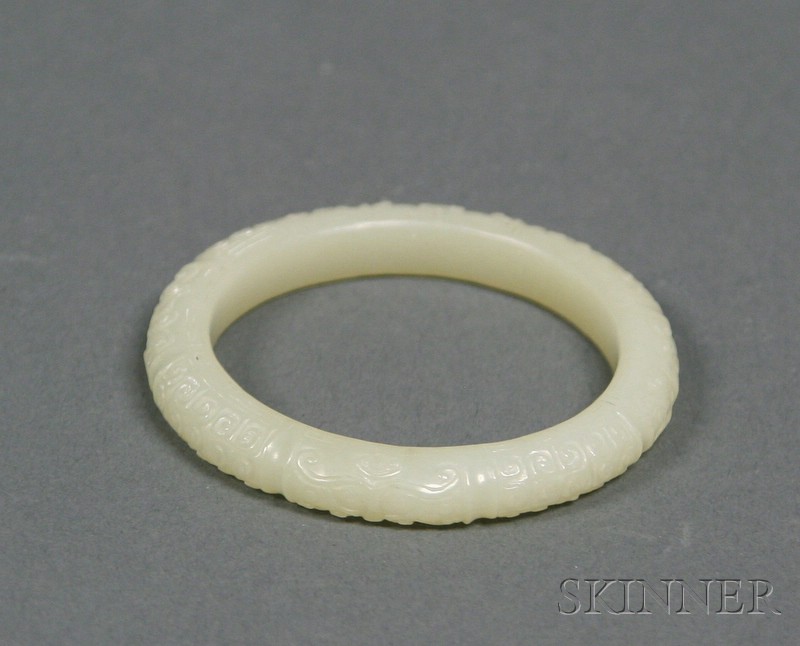 Appraisal: Jade Bracelet pale green stone surface carved with archaic scrolling