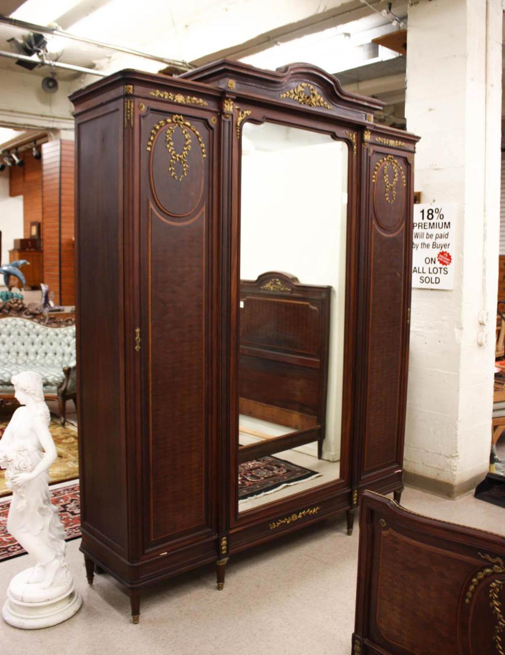 Appraisal: LOUIS XVI STYLE THREE-DOOR ARMOIRE French c mahogany parquet with