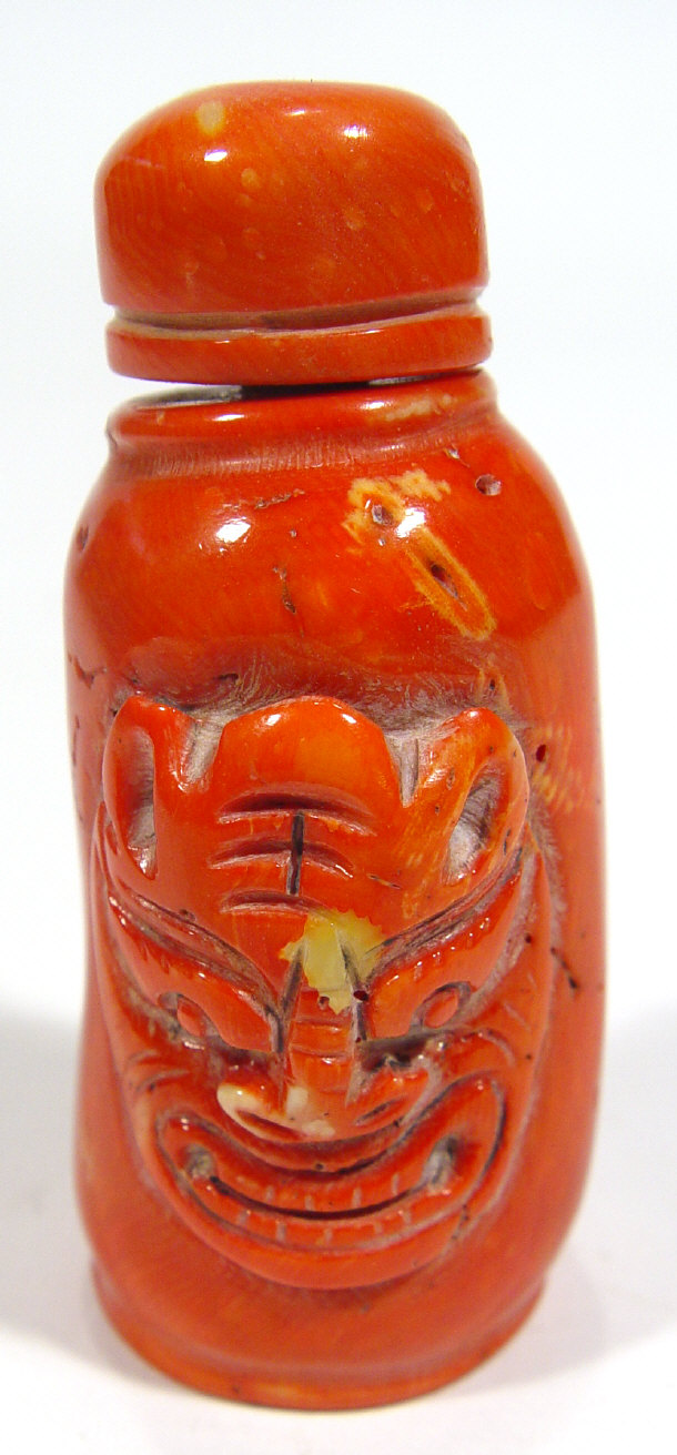 Appraisal: Chinese coral snuff bottle and stopper the body carved with