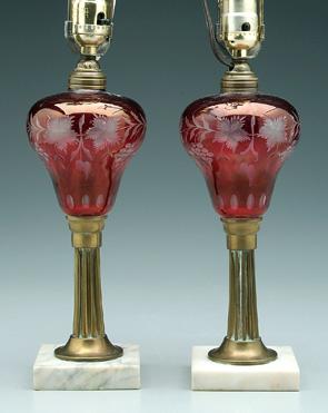 Appraisal: Pair cranberry to clear fluid lamps tapered brass posts with