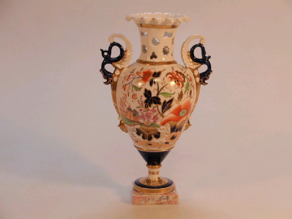 Appraisal: A thC porcelain two-handled urn painted and gilt with stylised