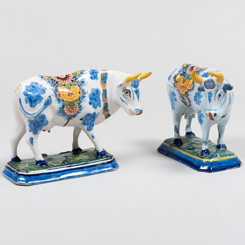 Appraisal: PAIR OF DELFT FIGURES OF COWSUnmarked x x in Provenance