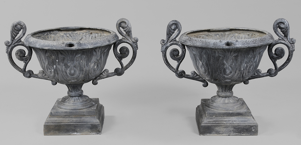 Appraisal: Pair Cast Iron Garden Urns th century each with leaf