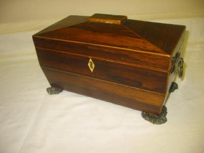 Appraisal: A GEORGE III ROSEWOOD TEA CADDY of sarcophagus form with