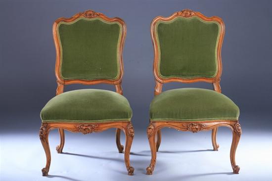 Appraisal: PAIR LOUIS XV STYLE CARVED WALNUT SIDE CHAIRS th century