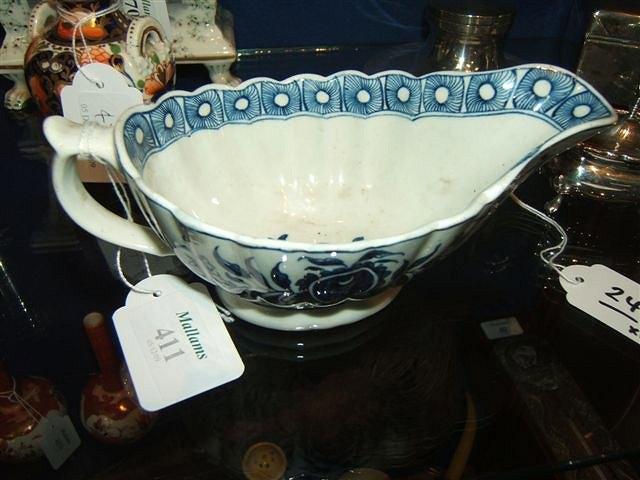 Appraisal: An th Century porcelain blue and white sauce boat decorated