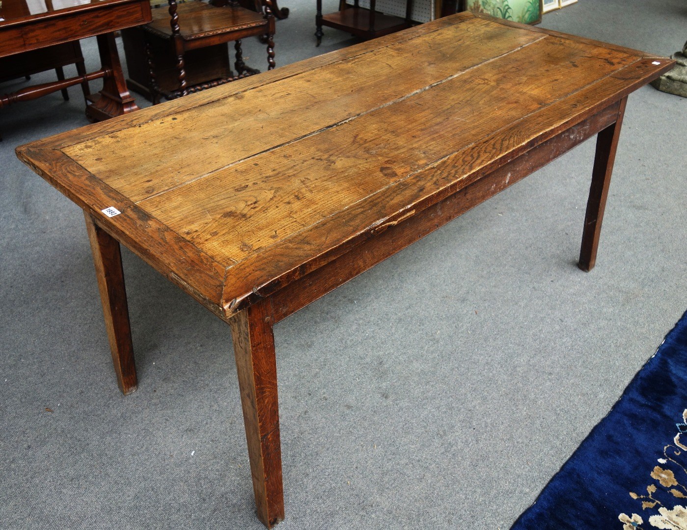 Appraisal: An th century contental oak kitchen table with three frieze