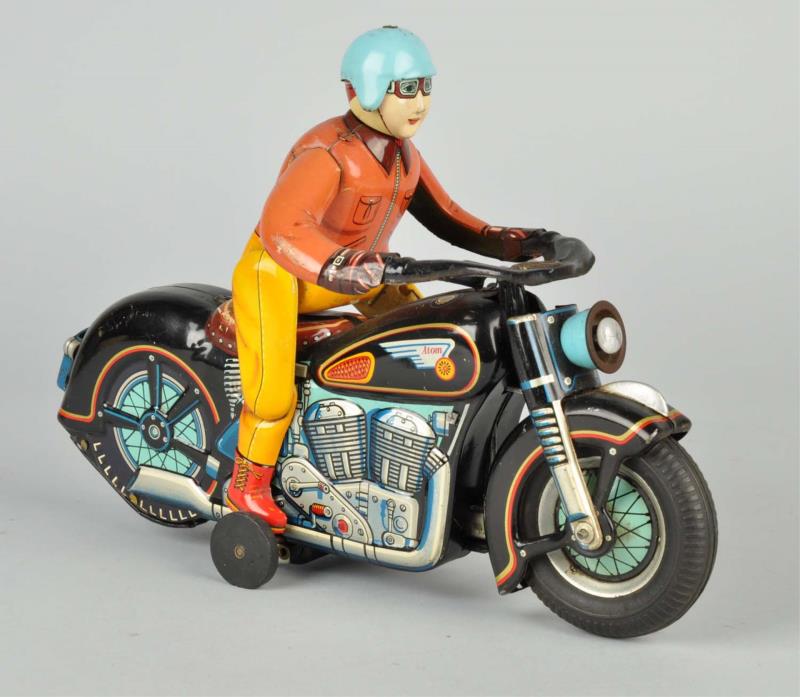 Appraisal: Japanese Tin Litho Atom Motorcycle Toy Battery-operated Works properly Rider