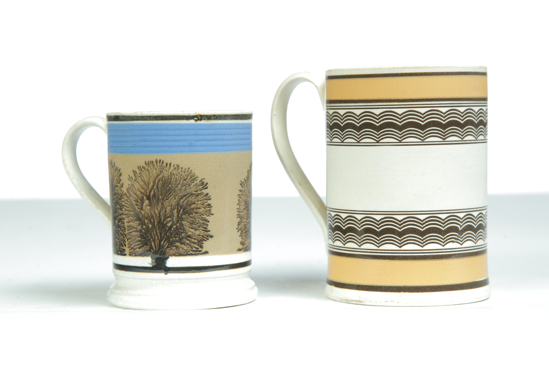 Appraisal: TWO MOCHA MUGS England st quarter- th century Seaweed with