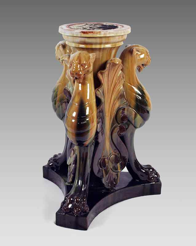 Appraisal: CLEMENT MASSIER MAJOLICA TRI FOOTED PEDESTAL With Roaring Gryphon and