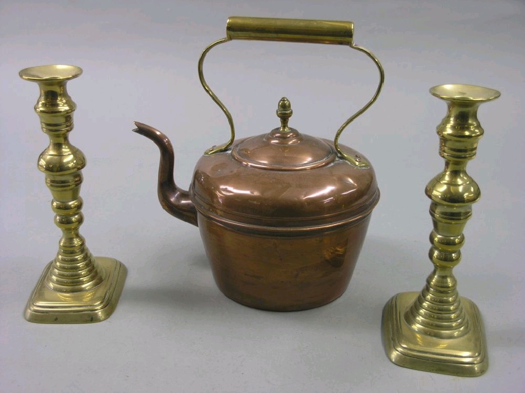 Appraisal: A Victorian style copper kettle two pairs of brass candlesticks