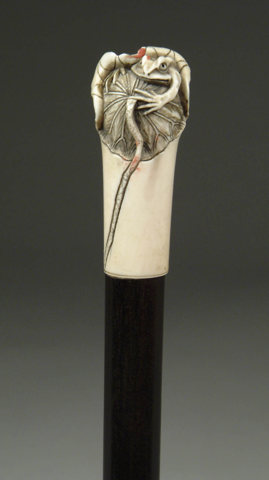 Appraisal: JAPANESE CARVED IVORY HANDLED CANE WITH FROG Small frog is