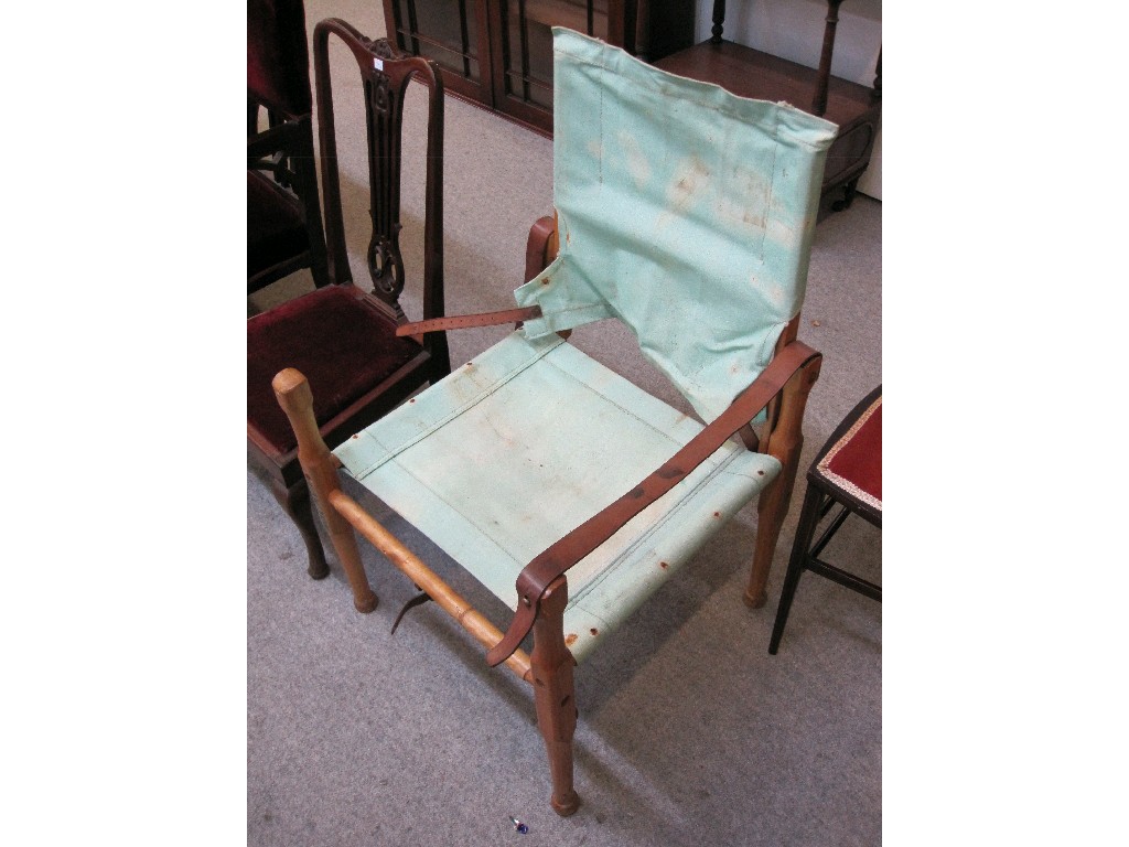 Appraisal: Wooden framed campaign chair with canvas seat and back and