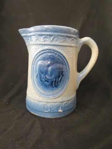 Appraisal: Blue White Stoneware Pitcher medallion with cows