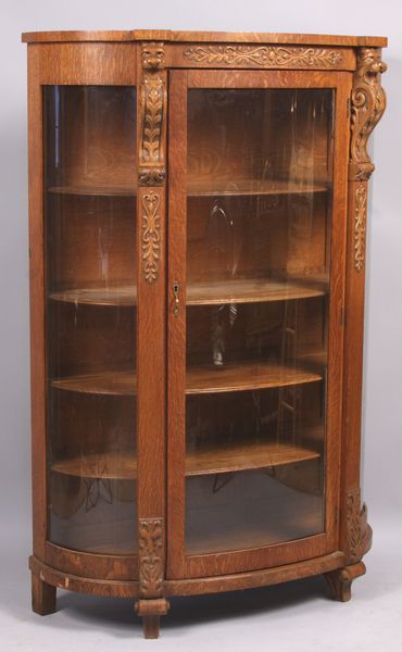 Appraisal: Late th Century carved oak curved glass china cabinet h