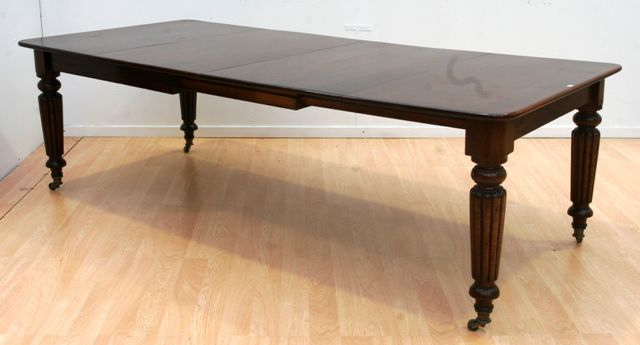 Appraisal: A Victorian mahogany extension dining table with two leaves x