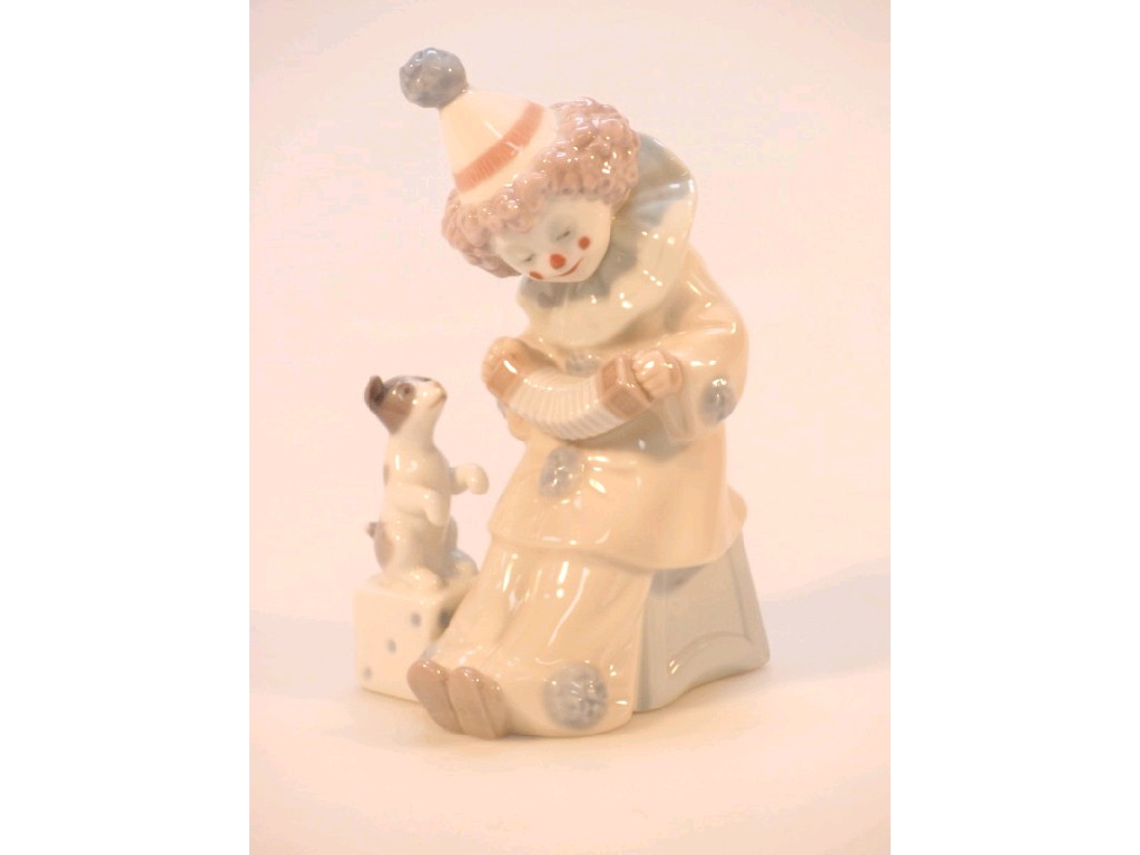 Appraisal: A Lladro figure of a young clown playing a concertina