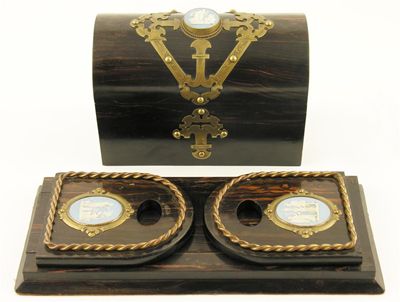 Appraisal: A Victorian coromandel domed stationery box with applied brass strapwork