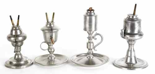 Appraisal: Four American pewter oil lamps mid th c bearing the