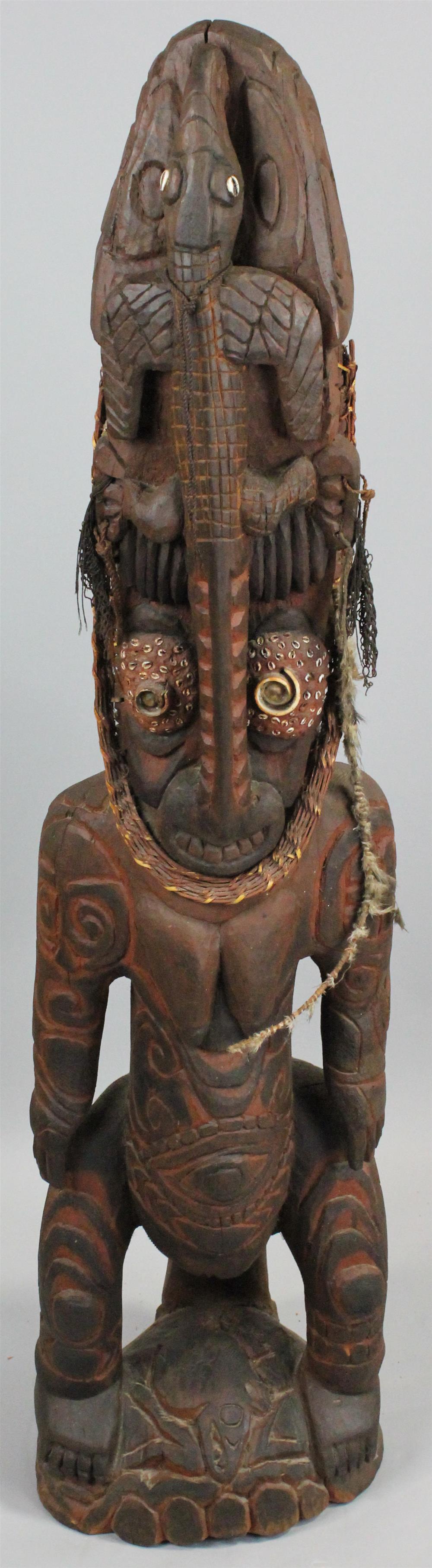 Appraisal: LARGE PAPUA NEW GUINEA CARVED FIGURE WITH CROCODILE POLYCHROME PAINTED