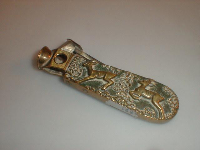 Appraisal: A heavy cast brass cigar cutter with stags in relief