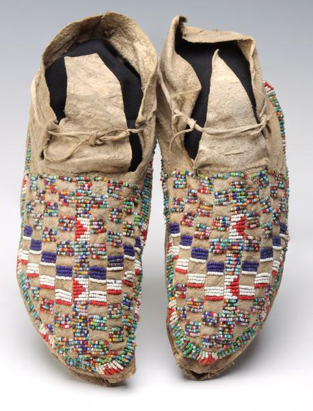 Appraisal: A PAIR NORTHERN PLAINS BEADED MOCCASINS CIRCA The pair possibly