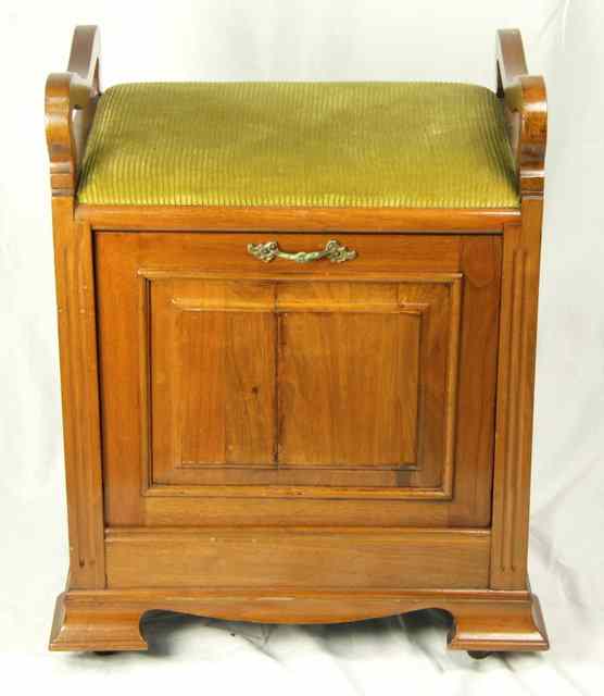 Appraisal: An Edwardian piano stool with music rack cm wide