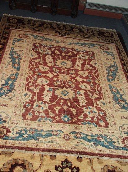 Appraisal: A MODERN TURKISH USAK STYLE RED GROUND RUG - decorated